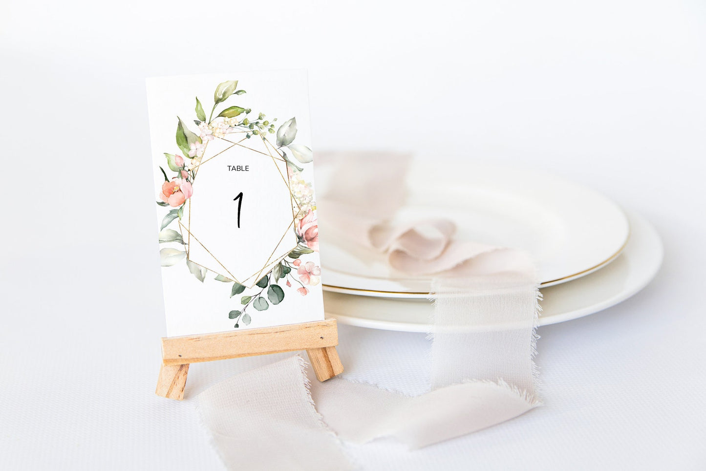 Table number template with a frame of pink flowers and leaves